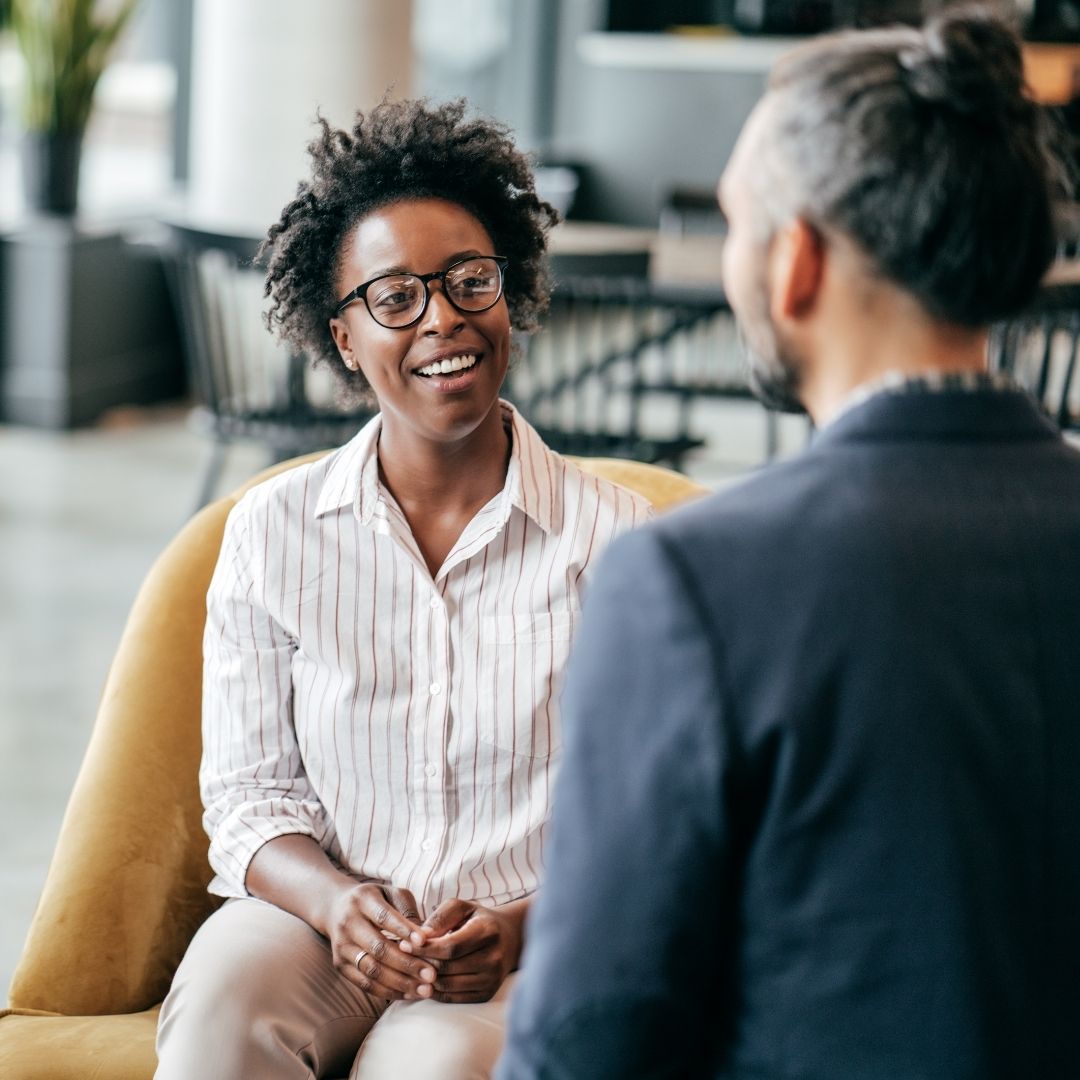 woman in discussion with man in a workplace